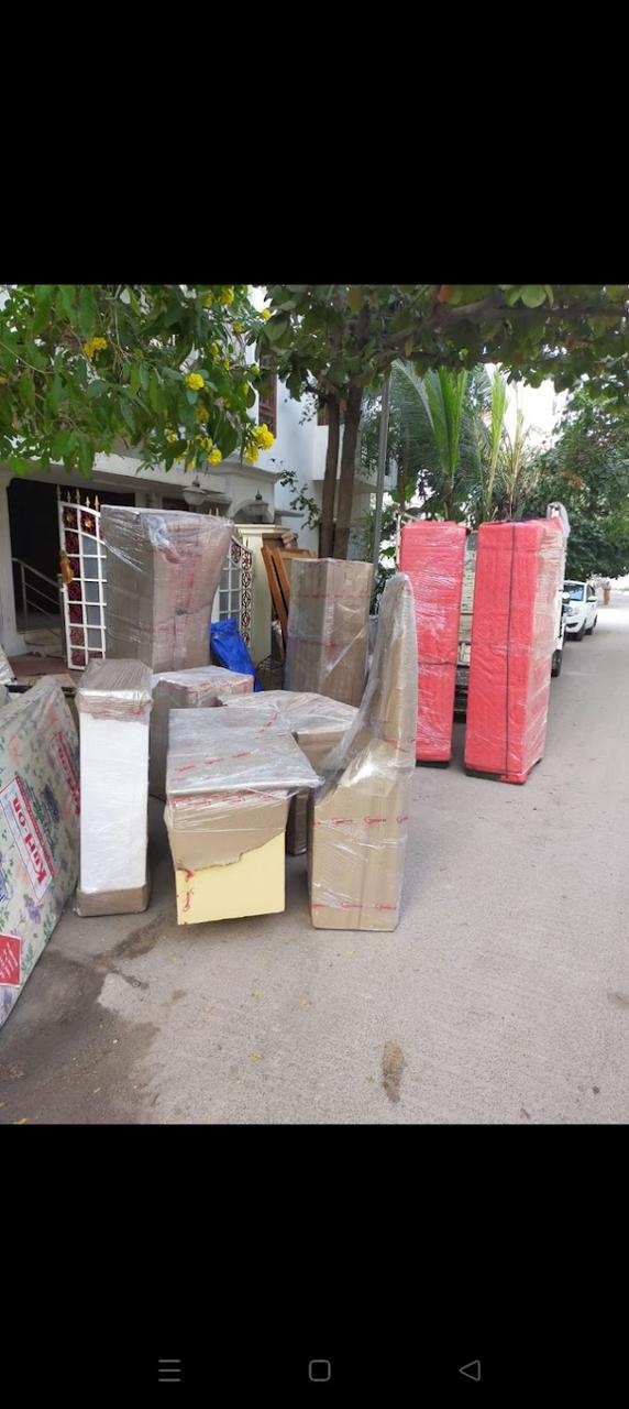 Packed household goods and mattresses ready outside home for shifting