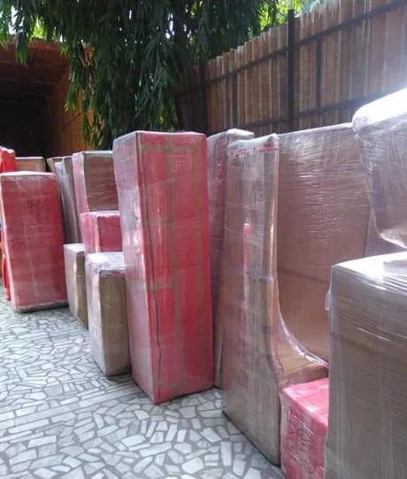 Large wardrobes wrapped and labeled for long-distance relocation