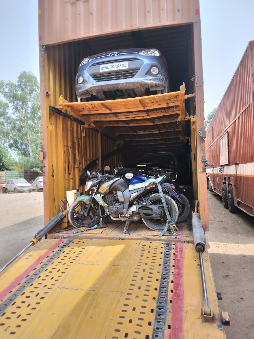 Car and bike transport inside double-decker container truck across India