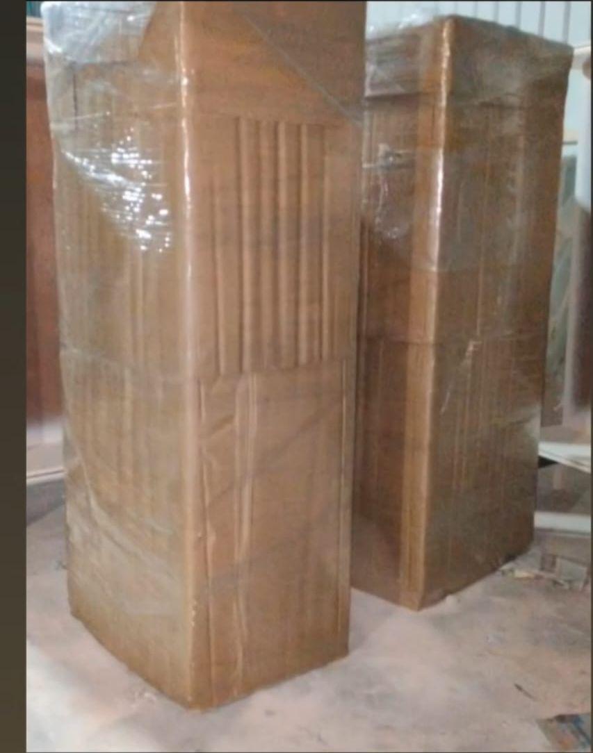 Tall wooden furniture securely packed with stretch film and tape