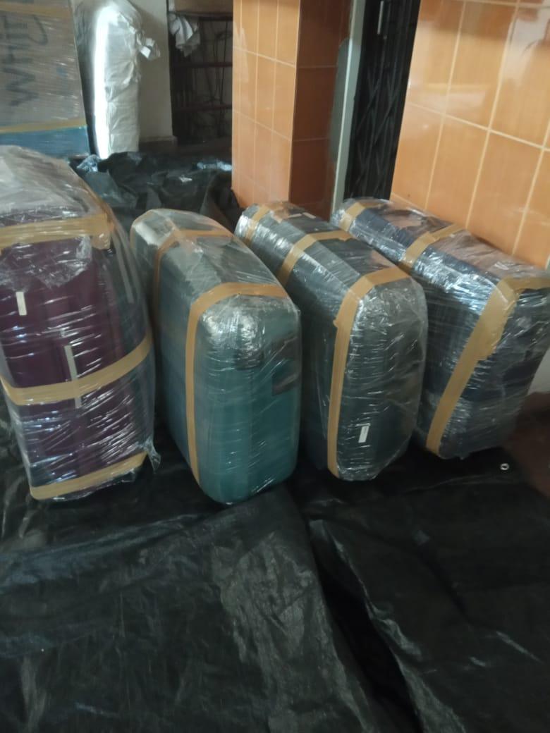 Suitcases wrapped and secured for safe long-distance transport