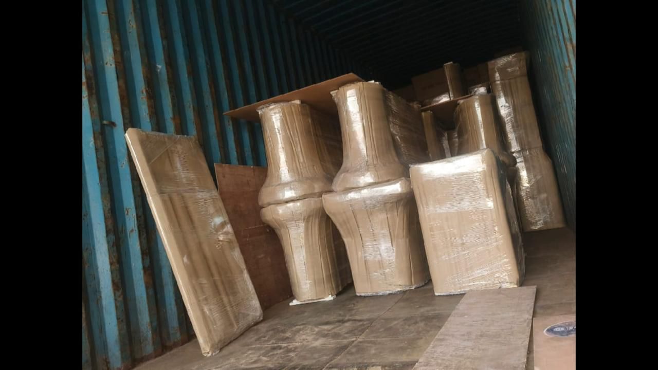 Wooden furniture corner-packed with corrugated sheets inside container