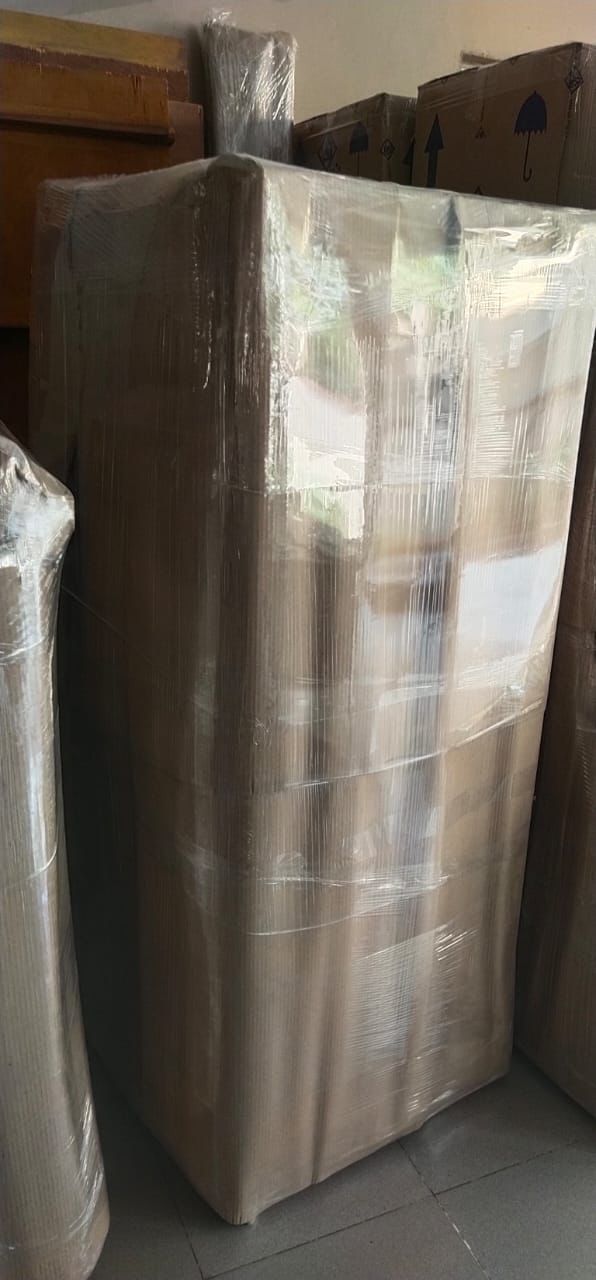 Wardrobe packed with corrugated sheets and stretch wrap