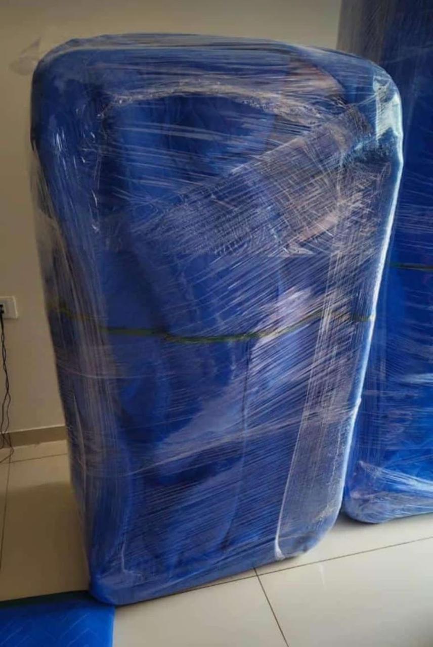 Refrigerator and home appliances bubble-wrapped for safe moving